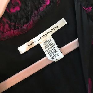 DVF-  Silk deep v- neck cut mid length dress.